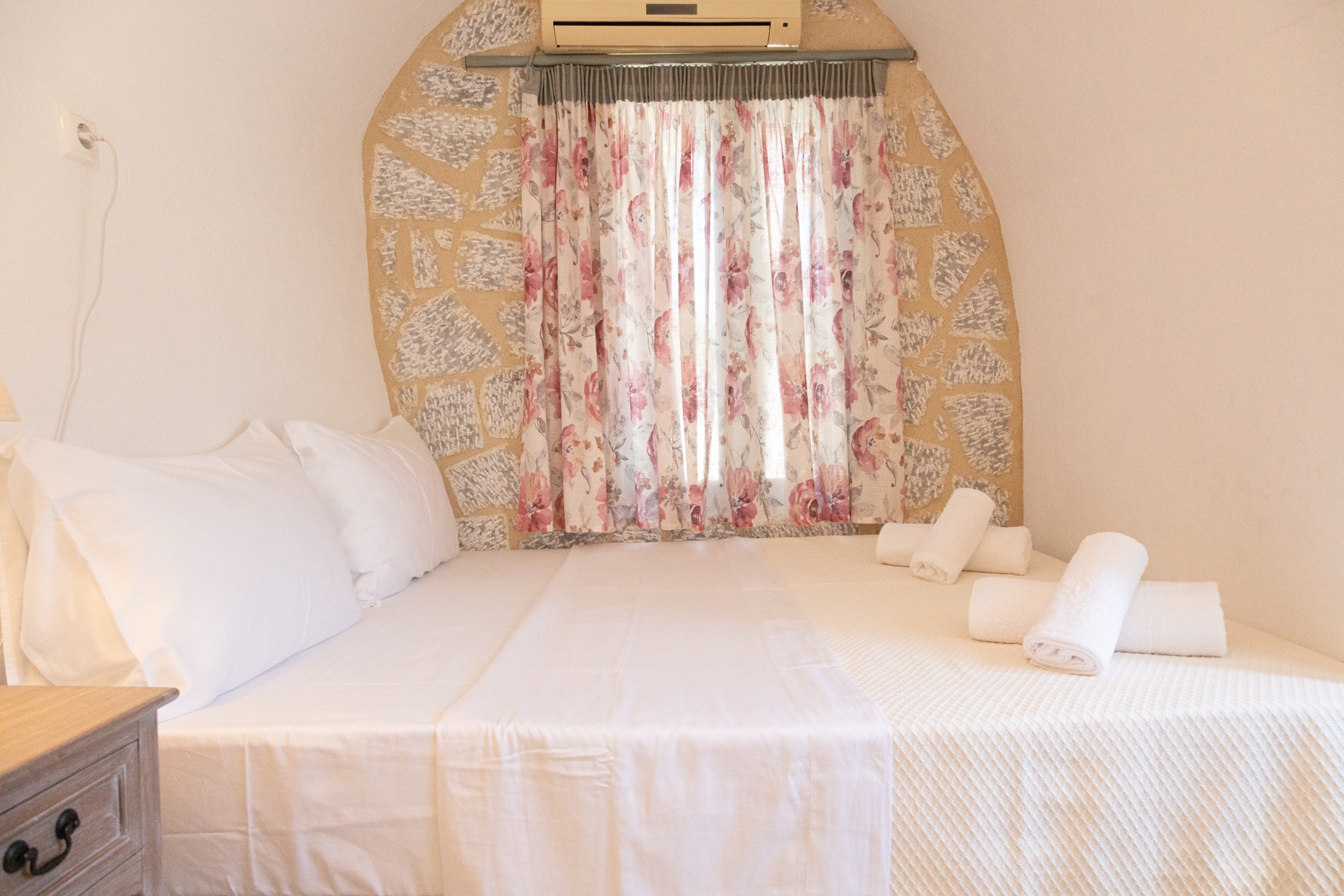 Queen size bed with floral arch headboard, Koufantonis Mansion Mani Greece